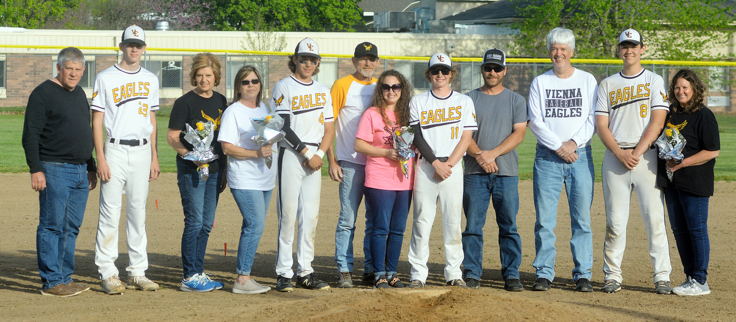 Vienna High School baseball senior players and their parents gather for a group photo behind the pitcher’s mound following their 3-0 victory over Cuba and before they took on Missouri Military Academy’s Colonels as part of a senior-night baseball doubleheader last Wednesday at Vienna City Park. VHS baseball seniors (from left) pictured with their parents include Bayrd Vanscoy, Spencer Magner, Lucas Magner and Colin John.
